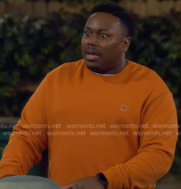 Marty's orange sweatshirt on The Neighborhood