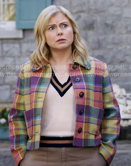 Sam's colorful plaid jacket and v-neck sweater on Ghosts