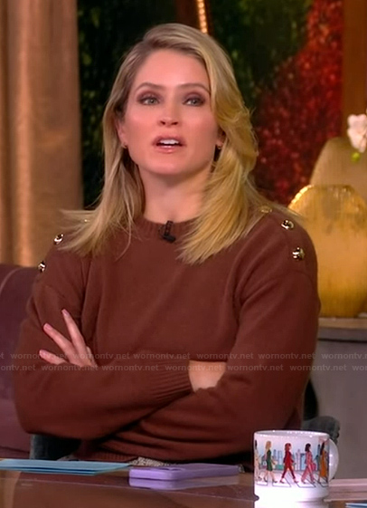 Sara's brown sweater with gold shoulder buttons on The View