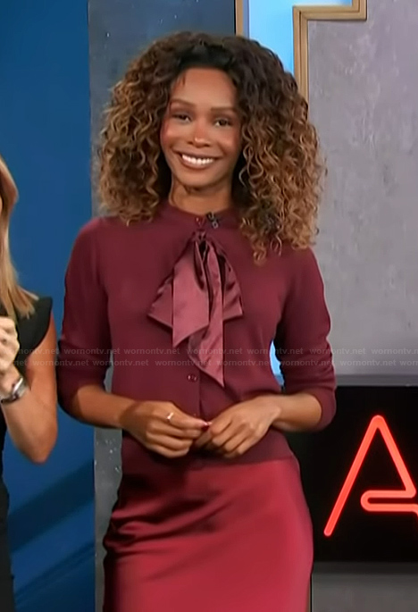 Zuri's burgundy bow cardigan on Access Hollywood