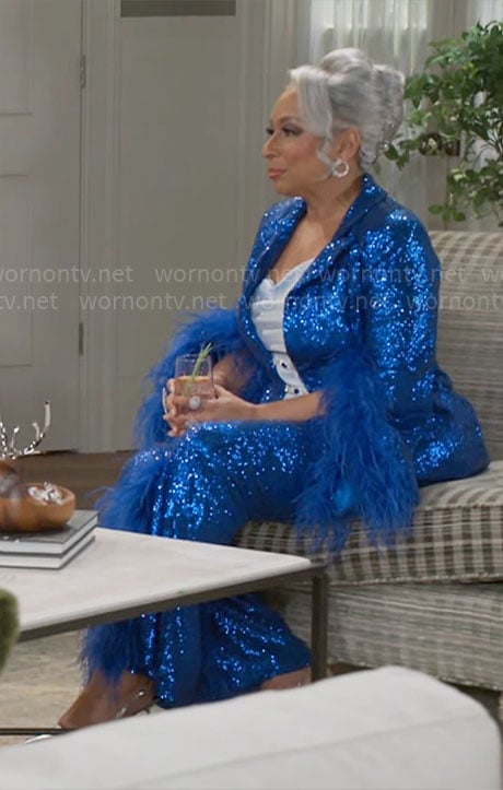 Anita's blue sequin suit with feather trims on Beyond the Gates
