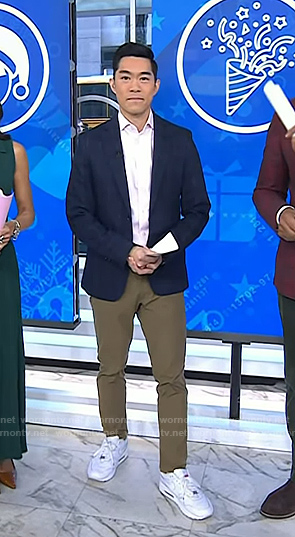 Brian Cheung's white sneakers with red tag on Today