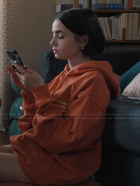 Emily's orange oversized hoodie on Emily in Paris