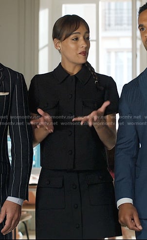 Genevieve's black short jacket and mini skirt on Emily in Paris
