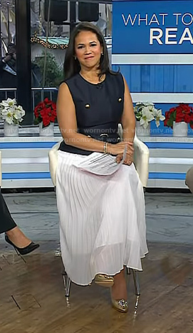 Laura's navy vest and white pleated skirt on Today