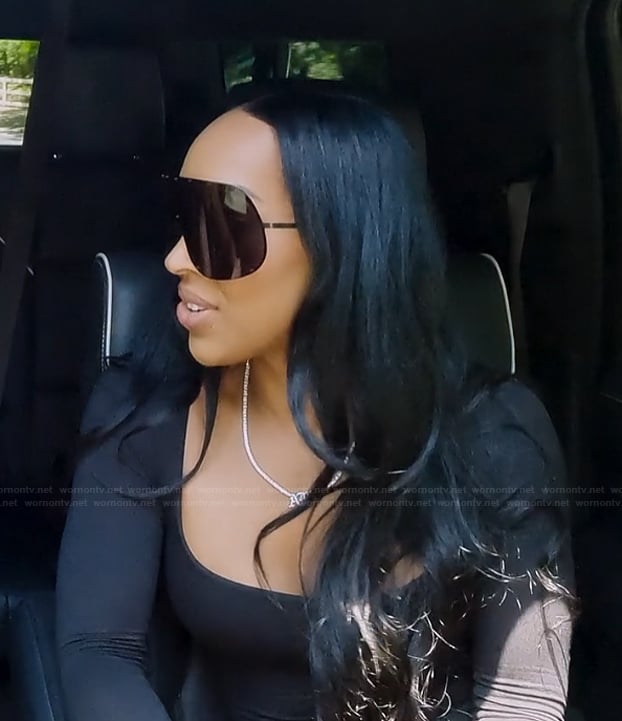 Malika's black shield sunglasses on The Kardashians