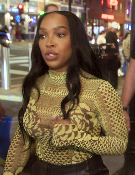 Malika's green printed mesh top on The Kardashians
