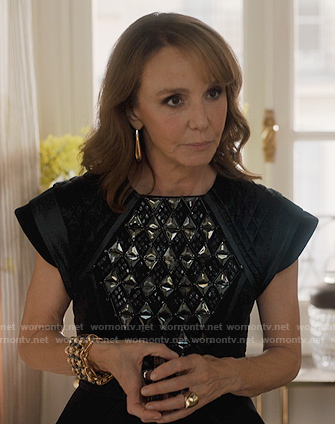 Sylvie's black studded peplum top on Emily in Paris
