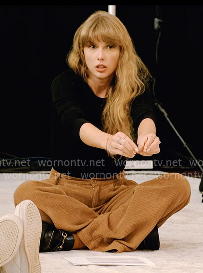 Taylor Swift's black top and corduroy pants on The End of an Era