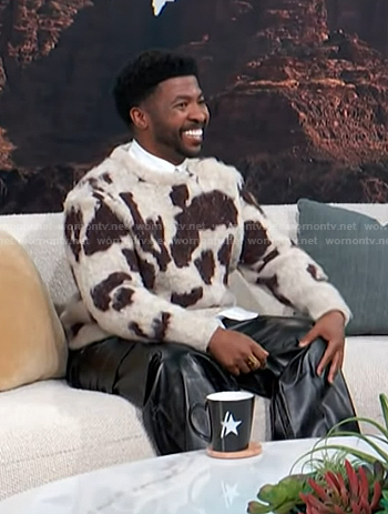 Trell Thomas's white and brown animal print sweater on Access Hollywood