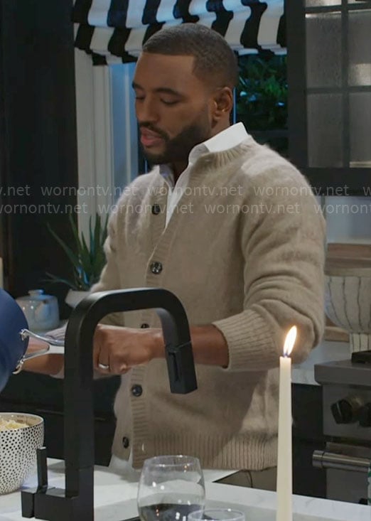 Andre's beige cardigan on Beyond the Gates