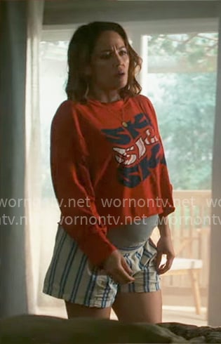 Angie's red ski graphic tee and striped shorts on Will Trent
