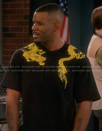 Bernard's black dragon print tee on The Upshaws