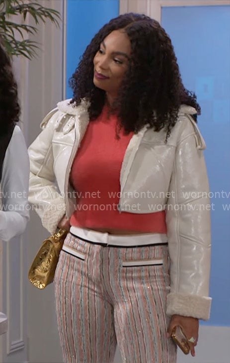 Chelsea's orange fluffy top, cropped jacket and striped pants on Beyond the Gates