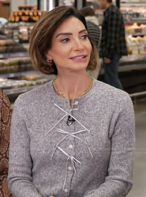 Courtney Lopez's gray cardigan on Access Hollywood