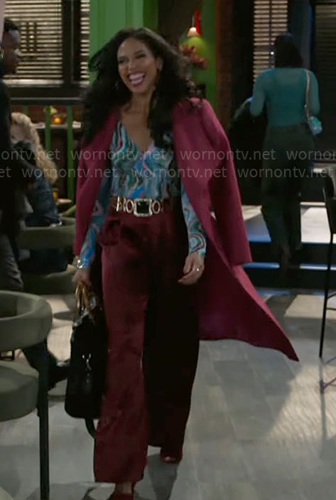 Dani's pink coat and marbled print top on Beyond the Gates