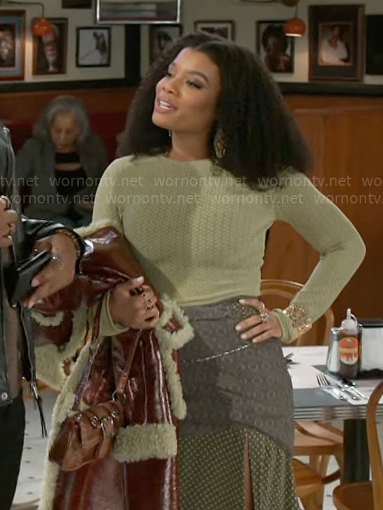 Eva's green pointelle knit sweater and printed skirt on Beyond the Gates