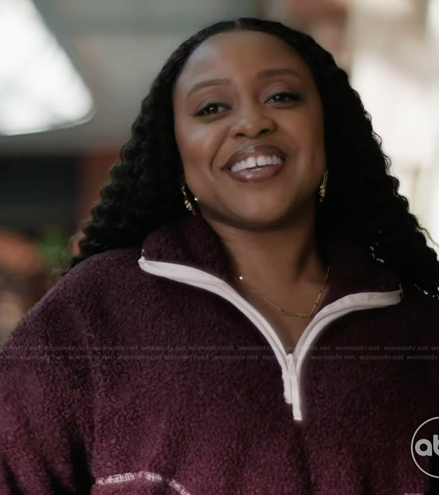 Janine's burgundy sherpa jacket on Abbott Elementary