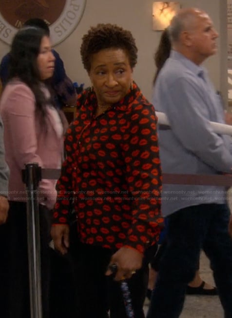 Lucretia's black lip print blouse on The Upshaws