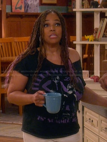 Regina's black Fleetwood Mac graphic tee on The Upshaws