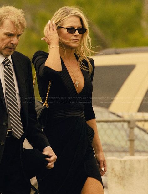 Angela's black plunging neckline dress on Landman