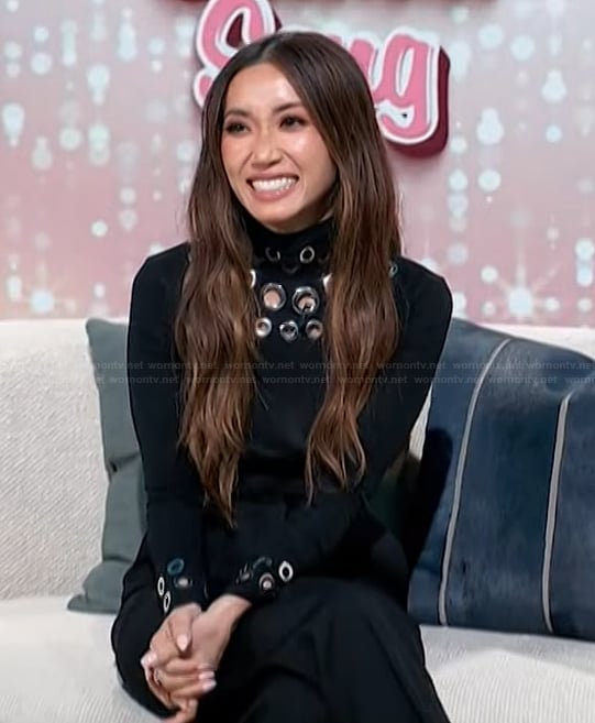 Brenda's black grommet embellished sweater on Access Hollywood
