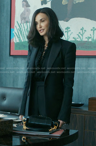 Cami's black ruffle blouse and blazer on Landman