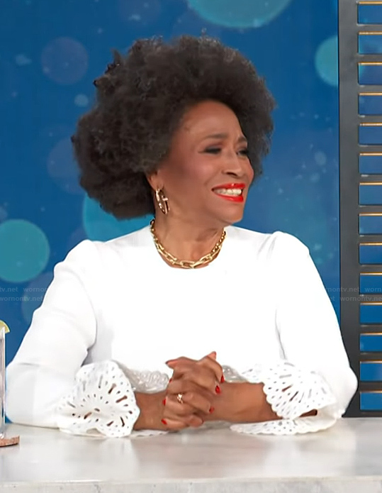 Jenifer Lewis's white bell cuff ribbed top on Access Hollywood