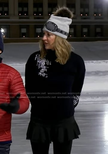 Lara's black embellsihed sweater and goggle print beanie on Good Morning America