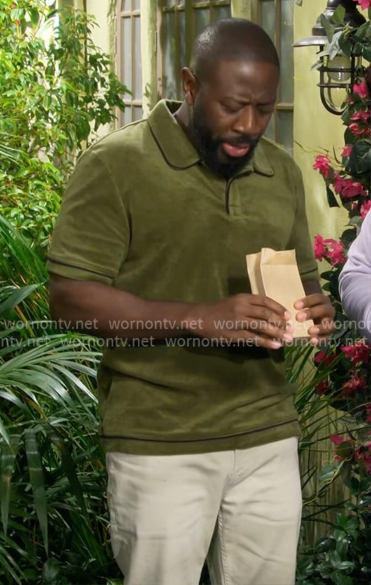 Malcolm's green terry polo on The Neighborhood