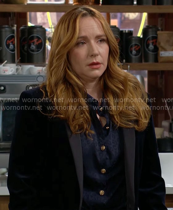 Mariah's navy blouse with gold buttons on The Young and the Restless