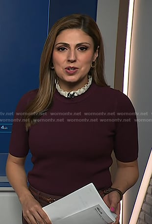Rana Novini's burgundy ruffle neck short sleeve sweater on NBC News Daily