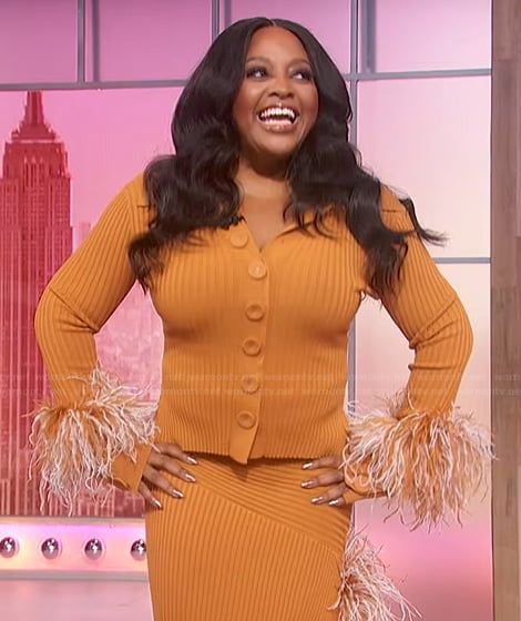 Sherri's orange feather trim cardigan and skirt on Sherri