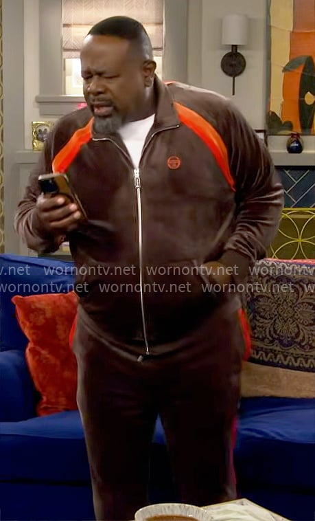Calvin's brown and orange velour track suit on The Neighborhood