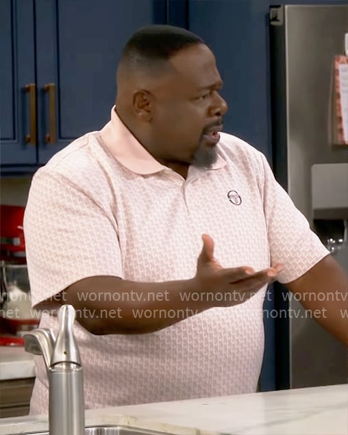 Calvin's pink printed polo shirt on The Neighborhood