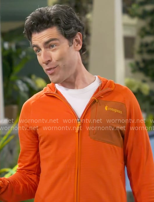 Dave's orange zip jacket on The Neighborhood