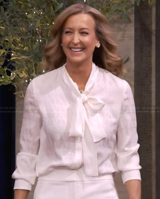 Lara Spencer's white silk tie neck blouse on Live with Kelly and Mark