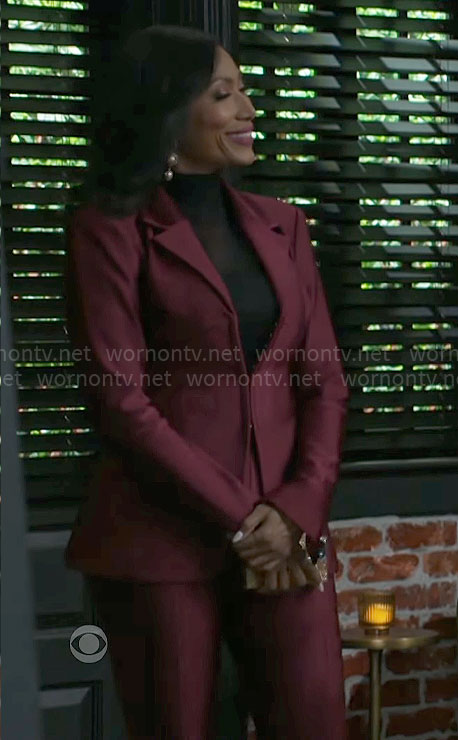 Leslie's burgundy corset suit on Beyond the Gates