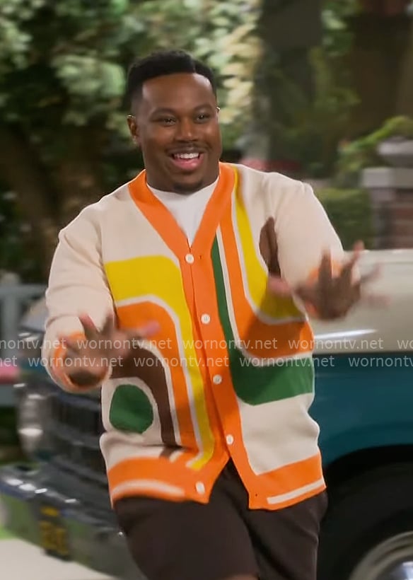 Marty's orange retro print cardigan on The Neighborhood