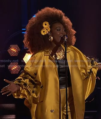 Alexia Jayy's yellow feather trim coat on The Voice