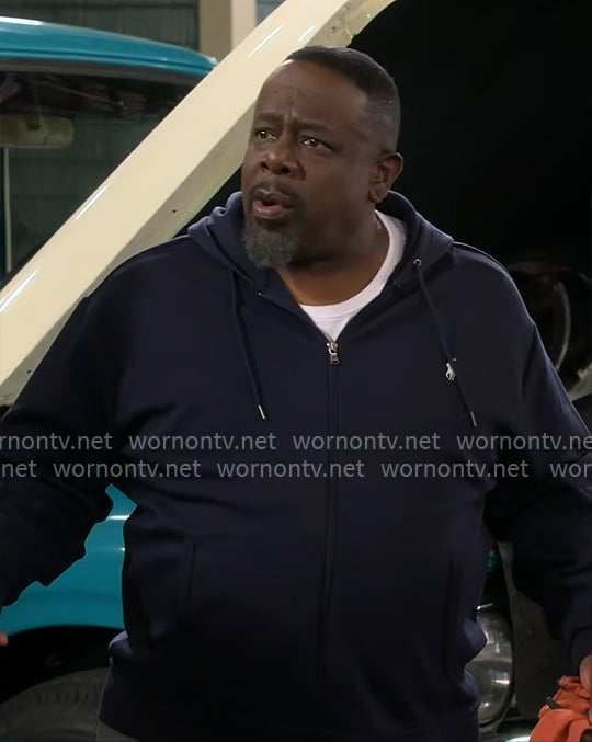 Calvin's navy zip hoodie on The Neighborhood