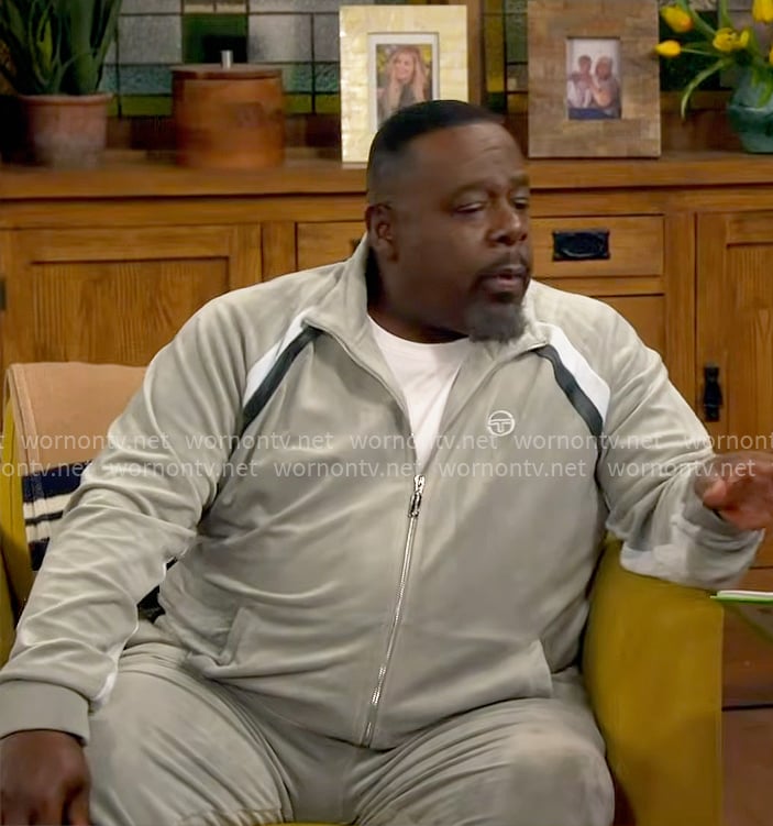Calvin's velour track suit with stripe details on The Neighborhood