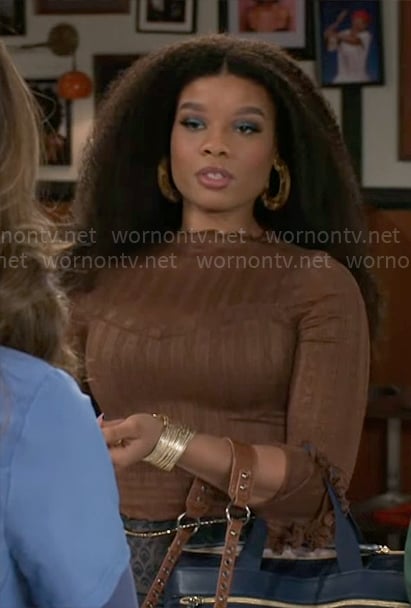 Eva's brown lace top on Beyond the Gates