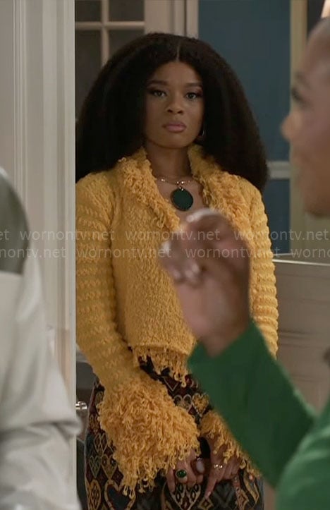 Eva's yellow fringed jacket and heart print skirt on Beyond the Gates