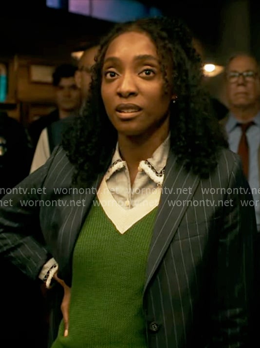 Faith's blue shirt and green sweater vest on Will Trent