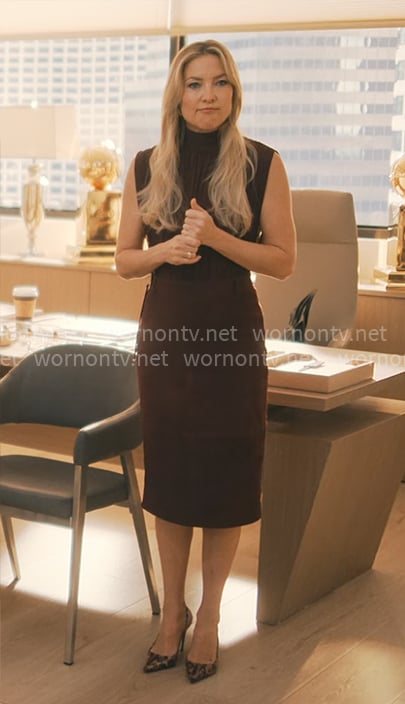 Isla's burgundy sleeveless blouse and skirt on Running Point