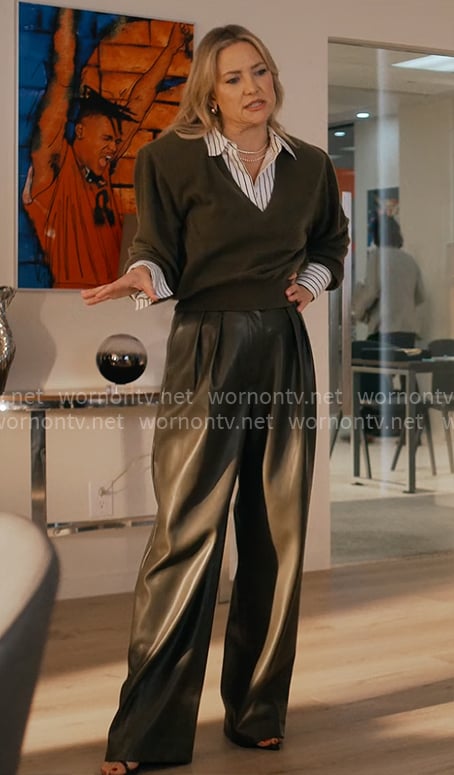 Isla's olive sweater with shoulder pads and leather pants on Running Point