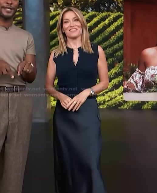 Kit's navy vest and satin skirt on Access Hollywood