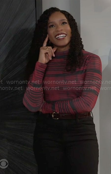 Naomi's black and red striped top on Beyond the Gates