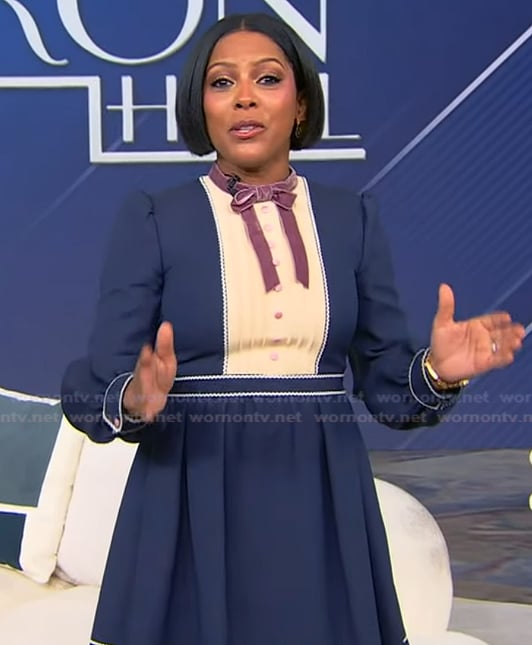 Tamron's blue tie neck mini dress on Tamron Hall Show